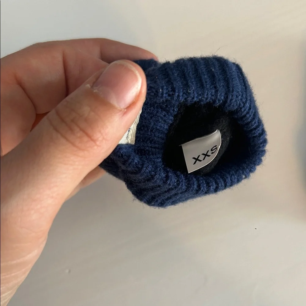 The North Face baby mittens in blue and brown